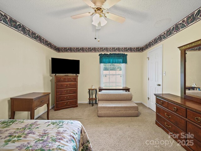 1302 Hawthorne Rd, Lancaster, SC 29720 - carpeted bedroom featuring a textured ceiling and ceiling fan