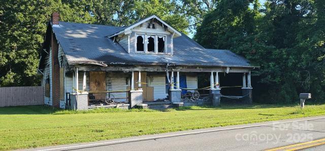 619 N Main St, Landis, NC 28088 - view of front of home featuring a porch and a chimney