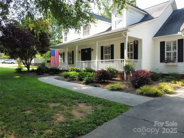 135 Primrose Dr, Salisbury, NC 28147 - cape cod house featuring a porch, a front yard, and roof with shingles