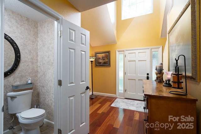 135 Primrose Dr, Salisbury, NC 28147 - foyer featuring dark wood-style floors, healthy amount of natural light, and a towering ceiling