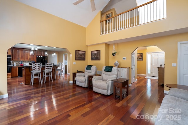 135 Primrose Dr, Salisbury, NC 28147 - living area with arched walkways, high vaulted ceiling, dark wood-type flooring, and a ceiling fan