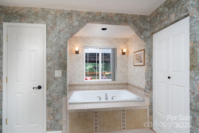 135 Primrose Dr, Salisbury, NC 28147 - bathroom featuring a bath and a textured ceiling