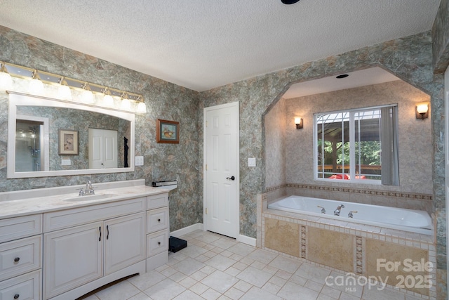 135 Primrose Dr, Salisbury, NC 28147 - bathroom featuring a textured ceiling, vanity, tile patterned floors, and a bath