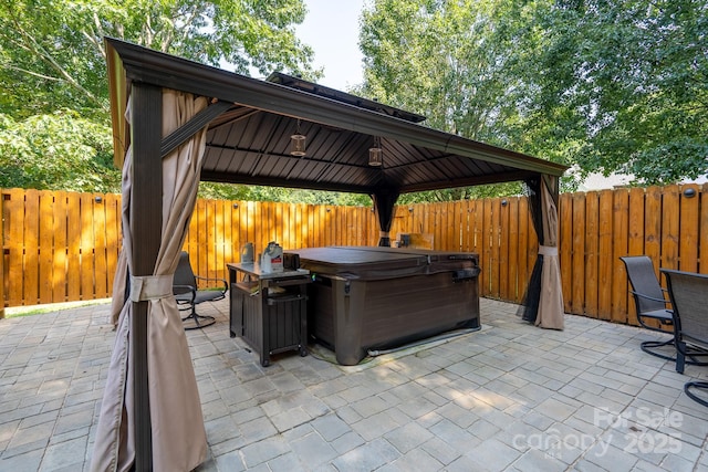 135 Primrose Dr, Salisbury, NC 28147 - fenced backyard featuring a gazebo, a patio, and a hot tub