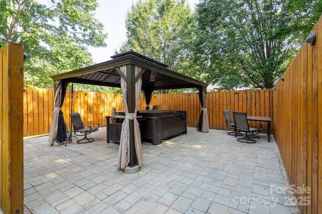 135 Primrose Dr, Salisbury, NC 28147 - fenced backyard with a hot tub, a gazebo, and a patio