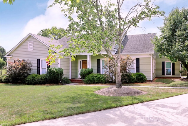 8829 Gelligum Dr, Charlotte, NC 28277 - view of front of home featuring a front yard, a shingled roof, and a porch