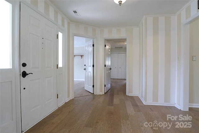 8829 Gelligum Dr, Charlotte, NC 28277 - entrance foyer featuring wood finished floors and wallpapered walls