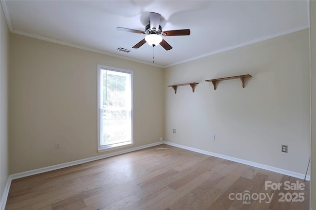8829 Gelligum Dr, Charlotte, NC 28277 - empty room featuring light wood finished floors, ceiling fan, and ornamental molding