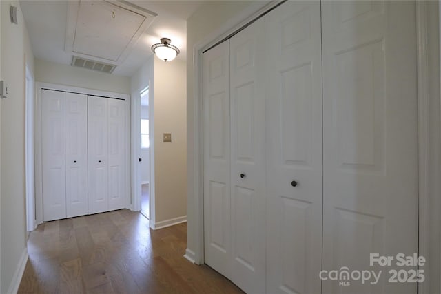8829 Gelligum Dr, Charlotte, NC 28277 - hall with attic access and wood finished floors