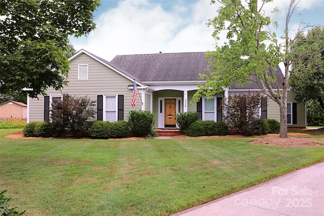 8829 Gelligum Dr, Charlotte, NC 28277 - view of front of house with roof with shingles and a front yard