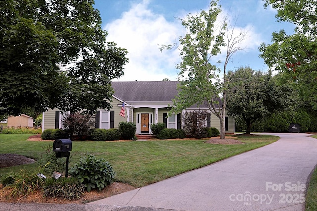 8829 Gelligum Dr, Charlotte, NC 28277 - view of front facade featuring a front lawn and roof with shingles