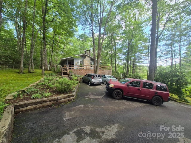 217 Shortoff Ln, Highlands, NC 28741 - view of front of house featuring a chimney and a deck