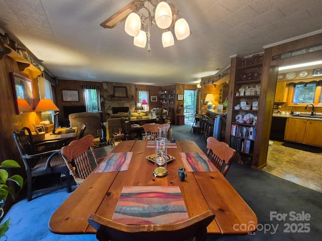 217 Shortoff Ln, Highlands, NC 28741 - carpeted dining room with wood walls and ceiling fan