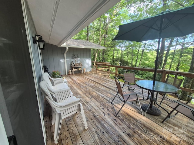 217 Shortoff Ln, Highlands, NC 28741 - wooden deck with outdoor dining area and view of scattered trees