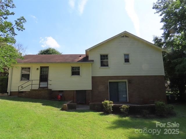 5823 Rupert Ln, Charlotte, NC 28215 - back of house featuring a yard and brick siding