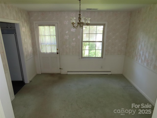 5823 Rupert Ln, Charlotte, NC 28215 - unfurnished dining area with baseboard heating, wallpapered walls, wainscoting, a chandelier, and carpet flooring