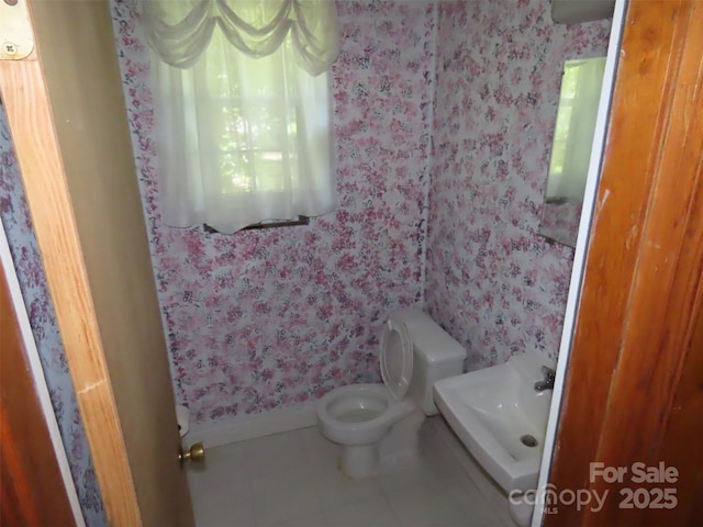 5823 Rupert Ln, Charlotte, NC 28215 - bathroom featuring wallpapered walls and tile patterned floors