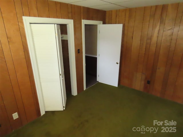 5823 Rupert Ln, Charlotte, NC 28215 - unfurnished bedroom with wooden walls and carpet flooring