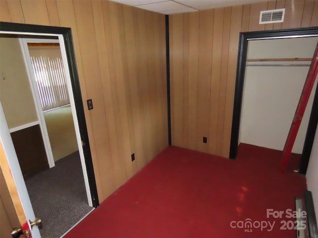 5823 Rupert Ln, Charlotte, NC 28215 - bedroom with wood walls and a closet
