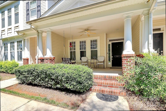 2044 Gable Way Ln, Matthews, NC 28104 - view of exterior entry with covered porch, brick siding, and a ceiling fan
