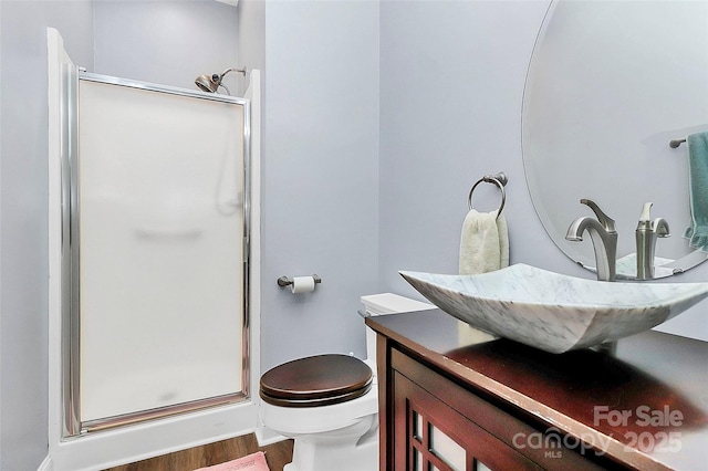 2044 Gable Way Ln, Matthews, NC 28104 - bathroom with a stall shower, wood finished floors, and vanity