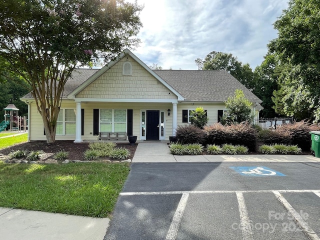 2044 Gable Way Ln, Matthews, NC 28104 - view of front of house with uncovered parking, a porch, and roof with shingles