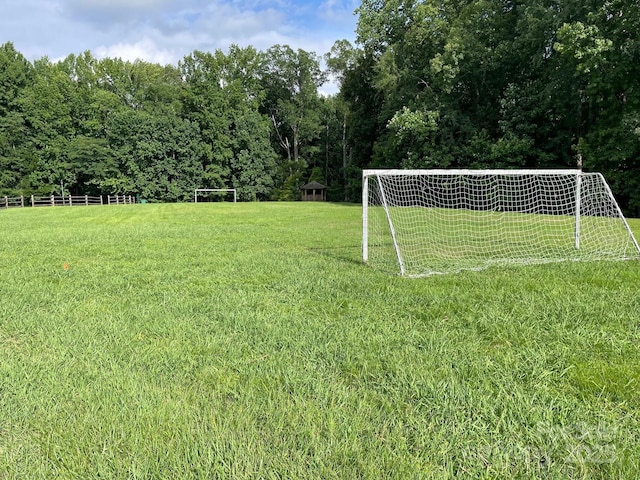 2044 Gable Way Ln, Matthews, NC 28104 - view of yard featuring an area for soccer and a wooded view