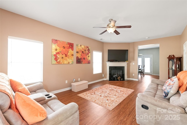 8618 Redding Glen Ave, Charlotte, NC 28216 - living room featuring ceiling fan, wood finished floors, and a glass covered fireplace