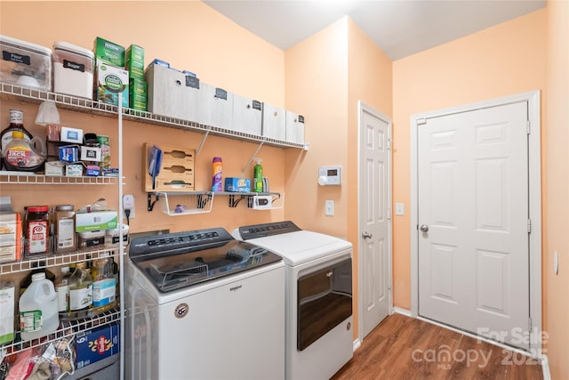 8618 Redding Glen Ave, Charlotte, NC 28216 - laundry area with washer and clothes dryer and wood finished floors