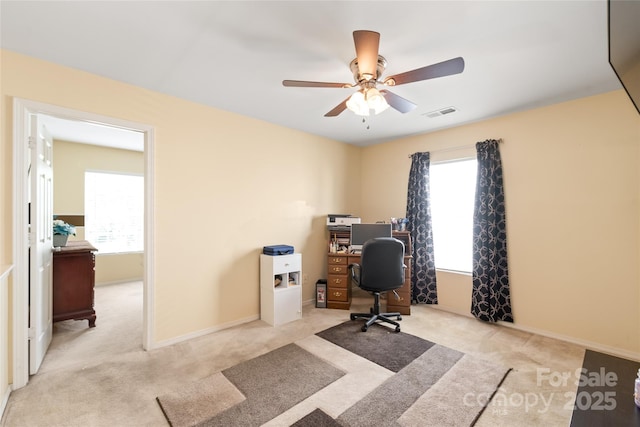 8618 Redding Glen Ave, Charlotte, NC 28216 - carpeted home office featuring plenty of natural light and a ceiling fan