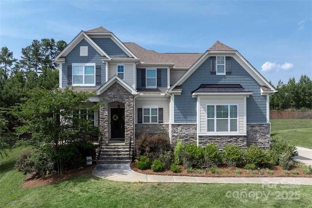 221 N Centurion Ln, Mount Holly, NC 28120 - craftsman-style house featuring a front yard, stone siding, a standing seam roof, and roof with shingles