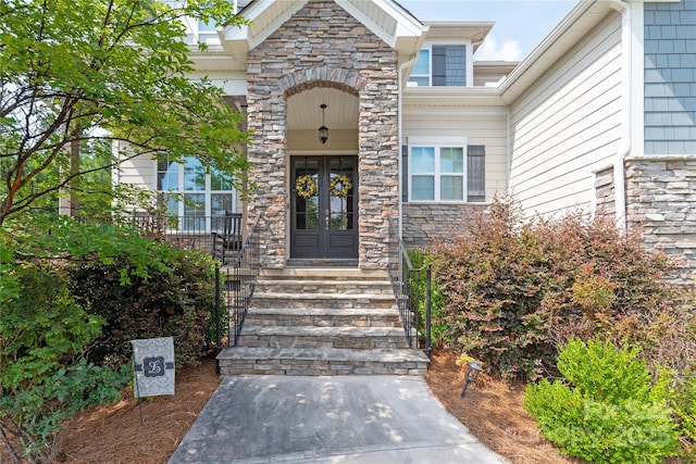 221 N Centurion Ln, Mount Holly, NC 28120 - view of exterior entry with french doors and stone siding