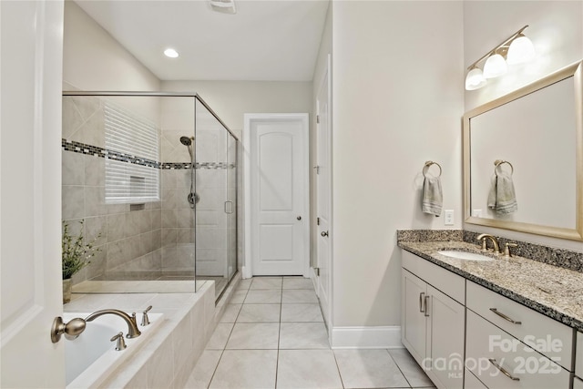 221 N Centurion Ln, Mount Holly, NC 28120 - bathroom with vanity, a stall shower, a bath, and tile patterned flooring