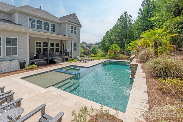 221 N Centurion Ln, Mount Holly, NC 28120 - view of swimming pool featuring a patio area and a pool with connected hot tub
