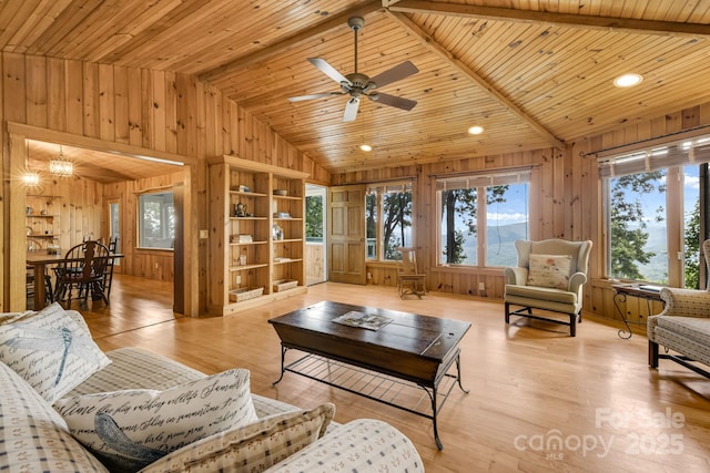 203 Laurel Ln, Little Switzerland, NC 28752 - living area with wood walls, healthy amount of natural light, wooden ceiling, ceiling fan, and light wood-style flooring