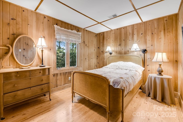 203 Laurel Ln, Little Switzerland, NC 28752 - bedroom with wood walls and wood finished floors