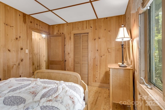 203 Laurel Ln, Little Switzerland, NC 28752 - bedroom with wood walls, wood finished floors, and a closet