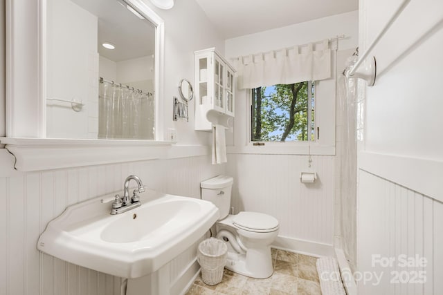 203 Laurel Ln, Little Switzerland, NC 28752 - full bath with a shower with shower curtain and a wainscoted wall