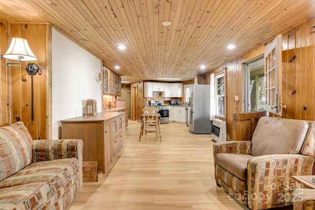 203 Laurel Ln, Little Switzerland, NC 28752 - living area with light wood-style floors, recessed lighting, wooden ceiling, heating unit, and wooden walls