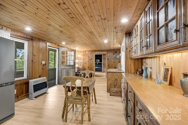 203 Laurel Ln, Little Switzerland, NC 28752 - dining area with heating unit, recessed lighting, wood walls, wooden ceiling, and light wood finished floors