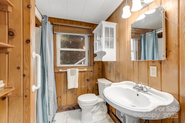203 Laurel Ln, Little Switzerland, NC 28752 - full bath featuring wood walls, marble look tiles, and a shower with shower curtain