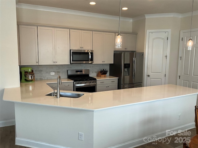 11608 Founders Park Ln, Pineville, NC 28134 - kitchen featuring stainless steel appliances, tasteful backsplash, light countertops, pendant lighting, and recessed lighting