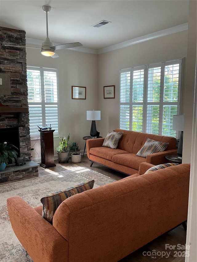11608 Founders Park Ln, Pineville, NC 28134 - living area featuring crown molding, a ceiling fan, and a fireplace