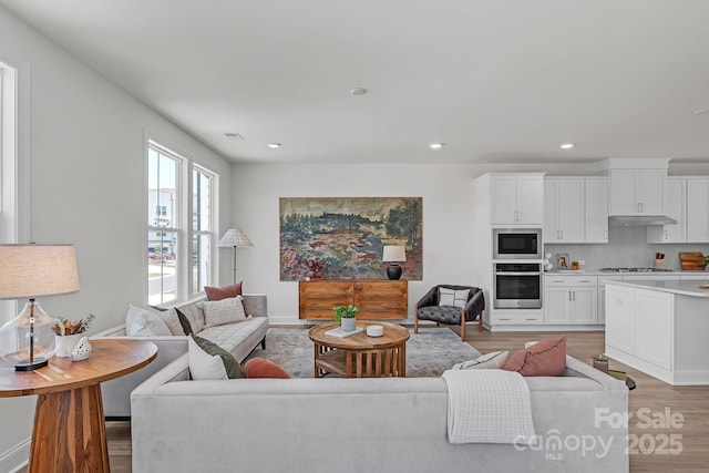 9212 Delancey Ln Unit 63, Concord, NC 28027 - living room featuring light wood-style flooring and recessed lighting