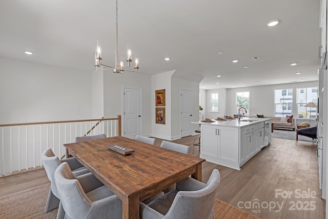 9212 Delancey Ln Unit 63, Concord, NC 28027 - dining room featuring light wood finished floors, a chandelier, and recessed lighting