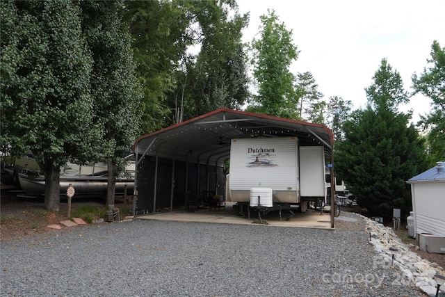 155 Holly Harbor Trl, Mount Gilead, NC 27306 - view of car parking featuring a carport and gravel driveway