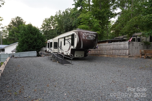 114 Redwood Trl, Mount Gilead, NC 27306 - view of parking / parking lot featuring view of wooded area