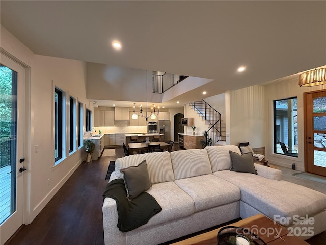 285 Poplar Crest Dr, Pisgah Forest, NC 28768 - living area with stairs, recessed lighting, dark wood-style floors, and a chandelier