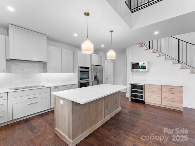 285 Poplar Crest Dr, Pisgah Forest, NC 28768 - kitchen with appliances with stainless steel finishes, wine cooler, recessed lighting, dark wood-style flooring, and a center island