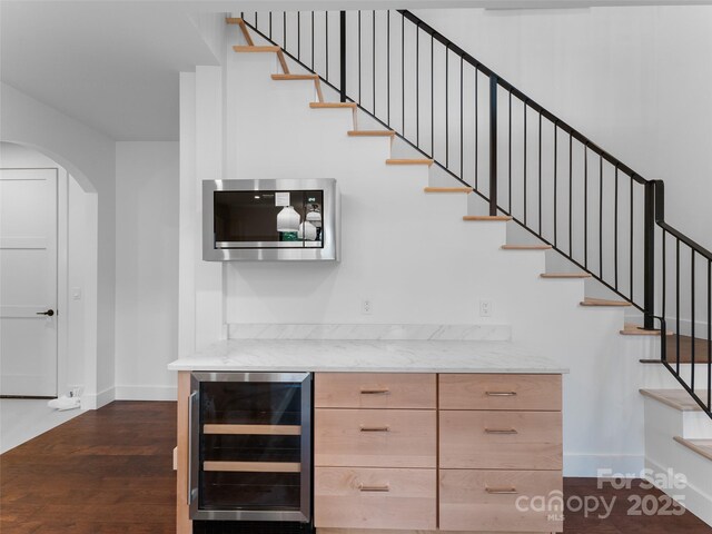 285 Poplar Crest Dr, Pisgah Forest, NC 28768 - stairs featuring beverage cooler, arched walkways, wood finished floors, and a bar